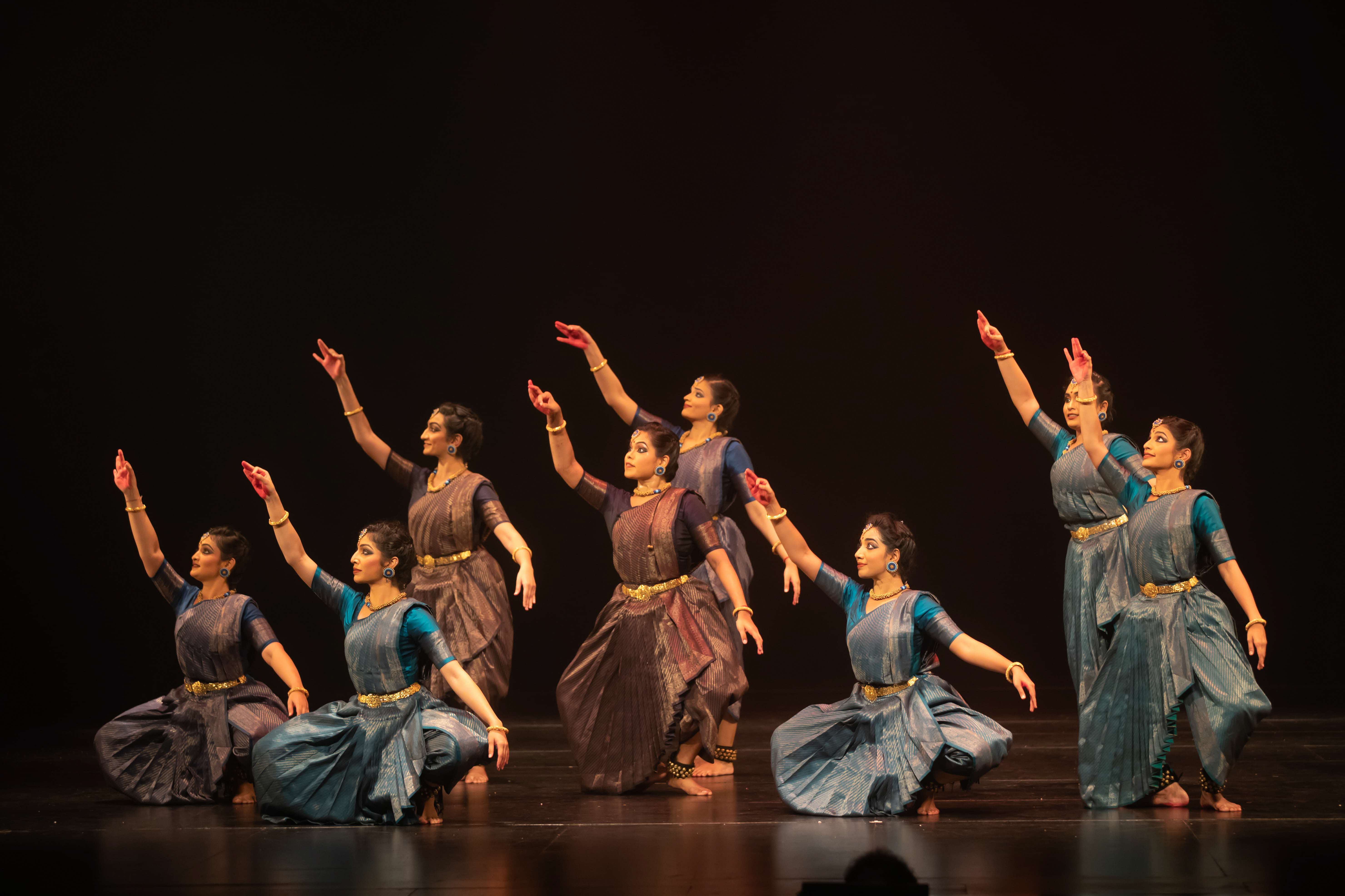 Dancers in mid-motion, showcasing their elegant lines for 'ARISI:Rice'. Image Credit: Apsaras Dance Company